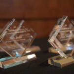 Partners in Giving awards sit on a tabletop